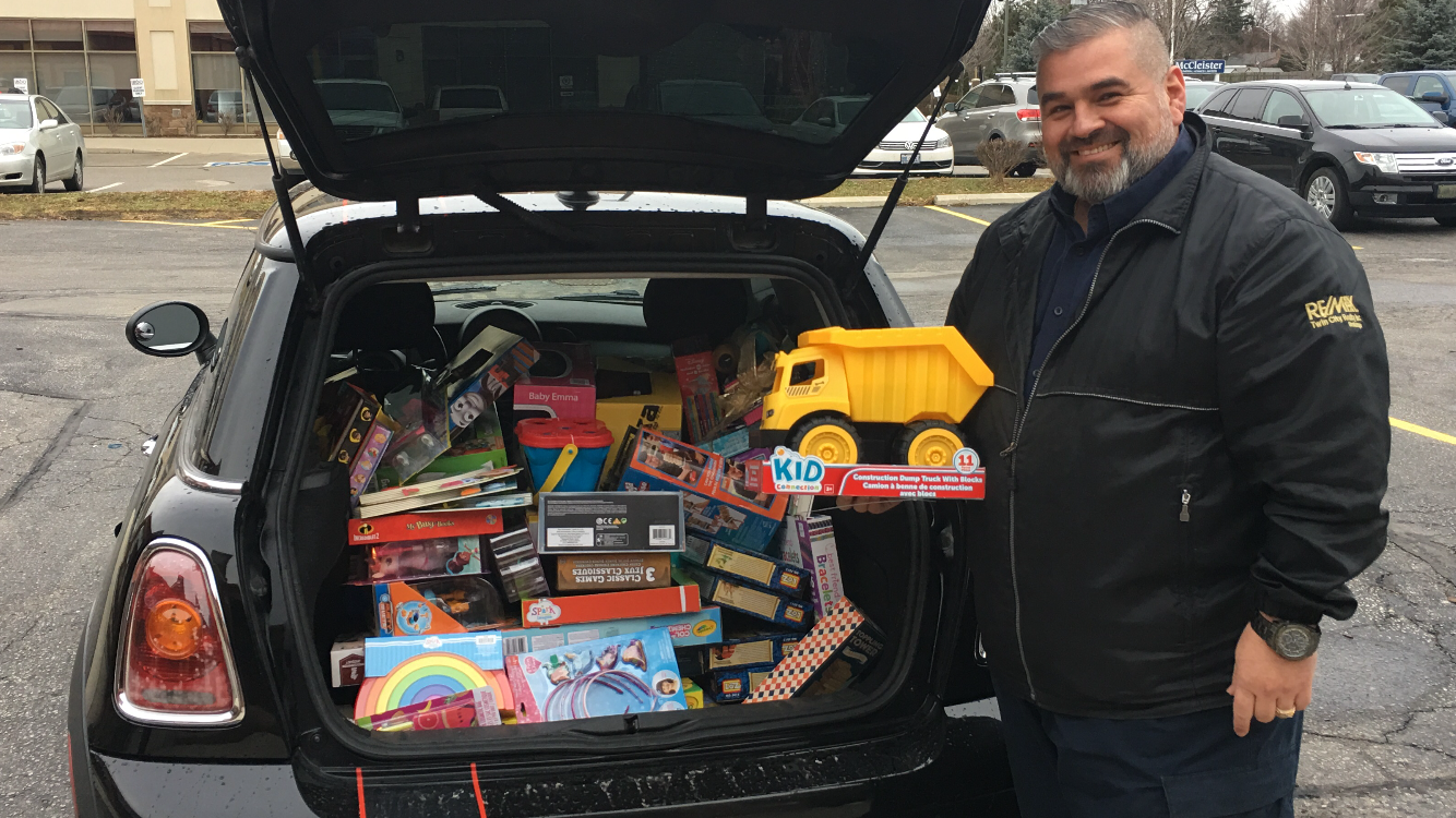 Wally Olivieri with trunk filled with toys